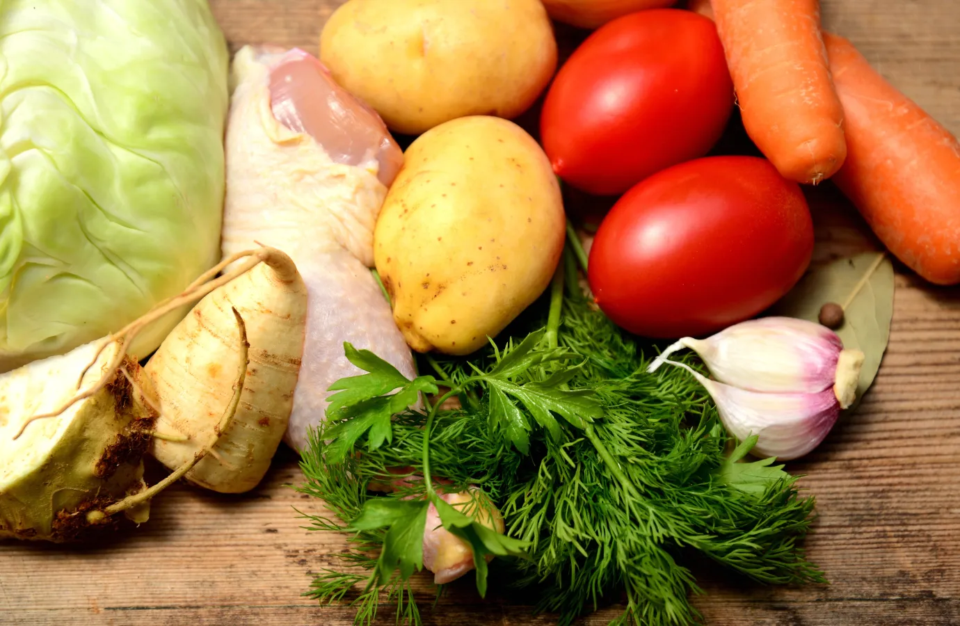 Fresh ingredients laid out for making cabbage soup