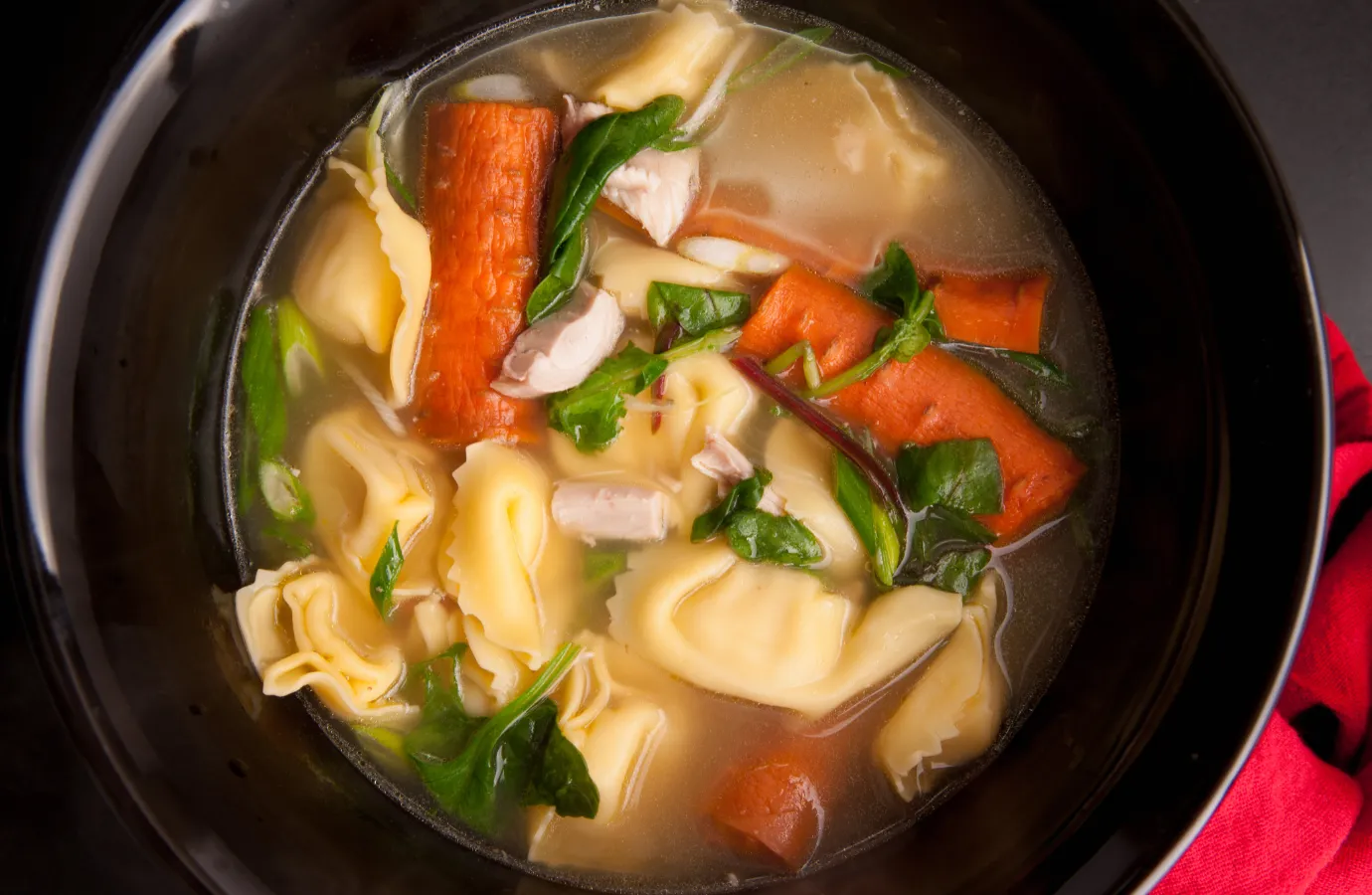 Searing meat in a pan for added soup flavor