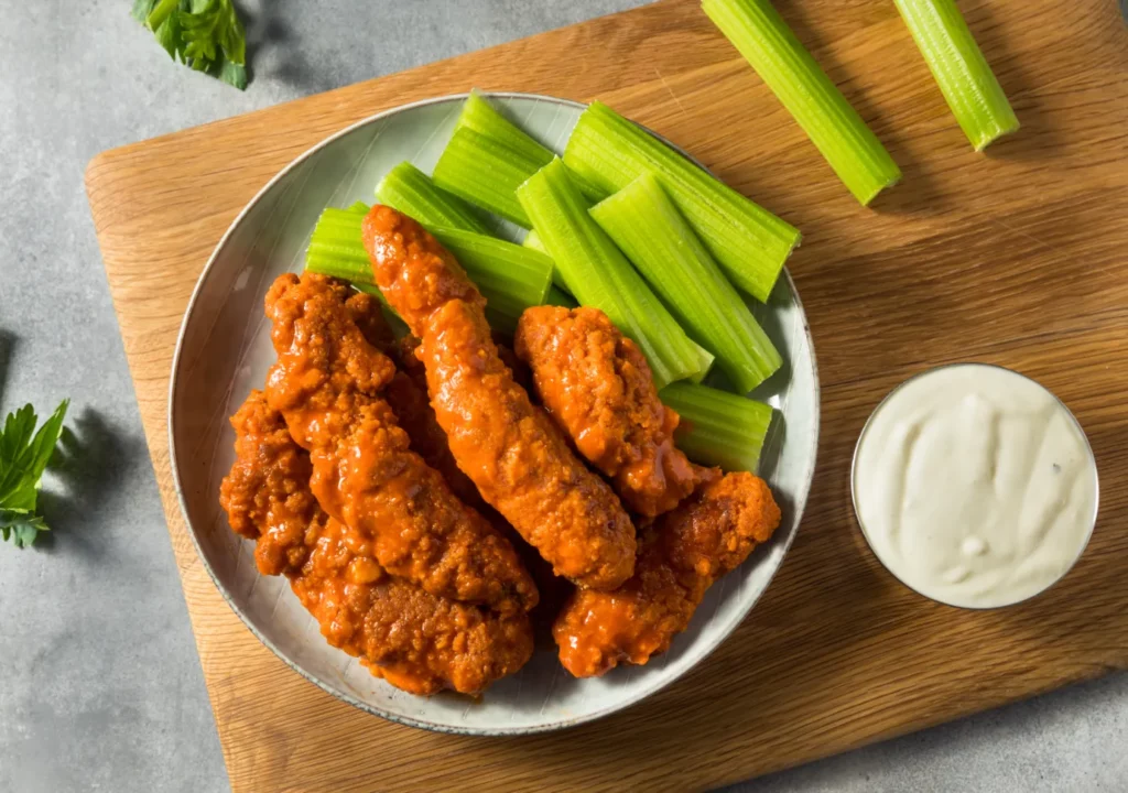 Platter of Buffalo Chicken Tenders with dipping sauce.