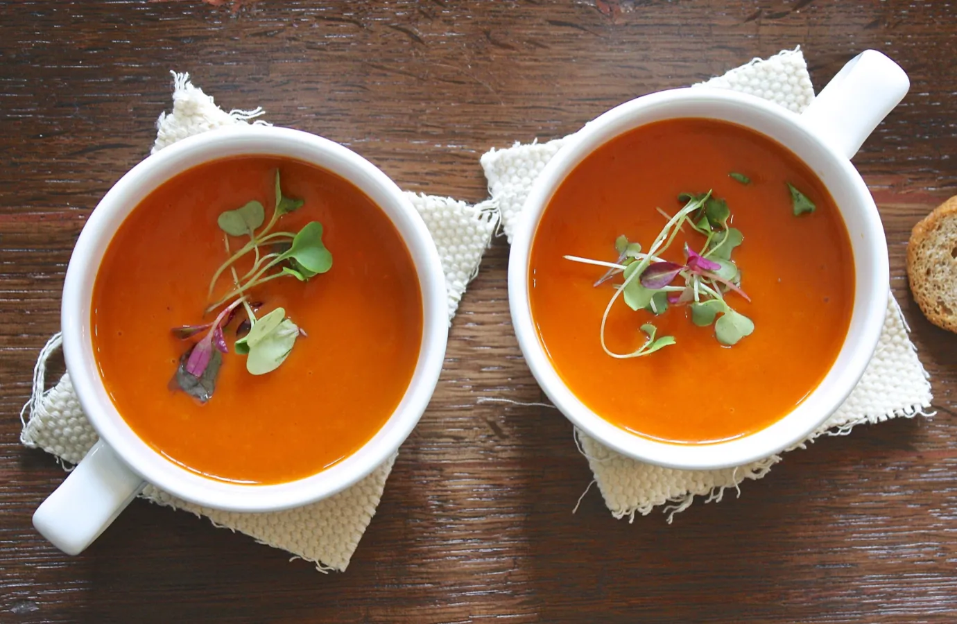 Colorful bowl of vegetable soup with fresh herbs