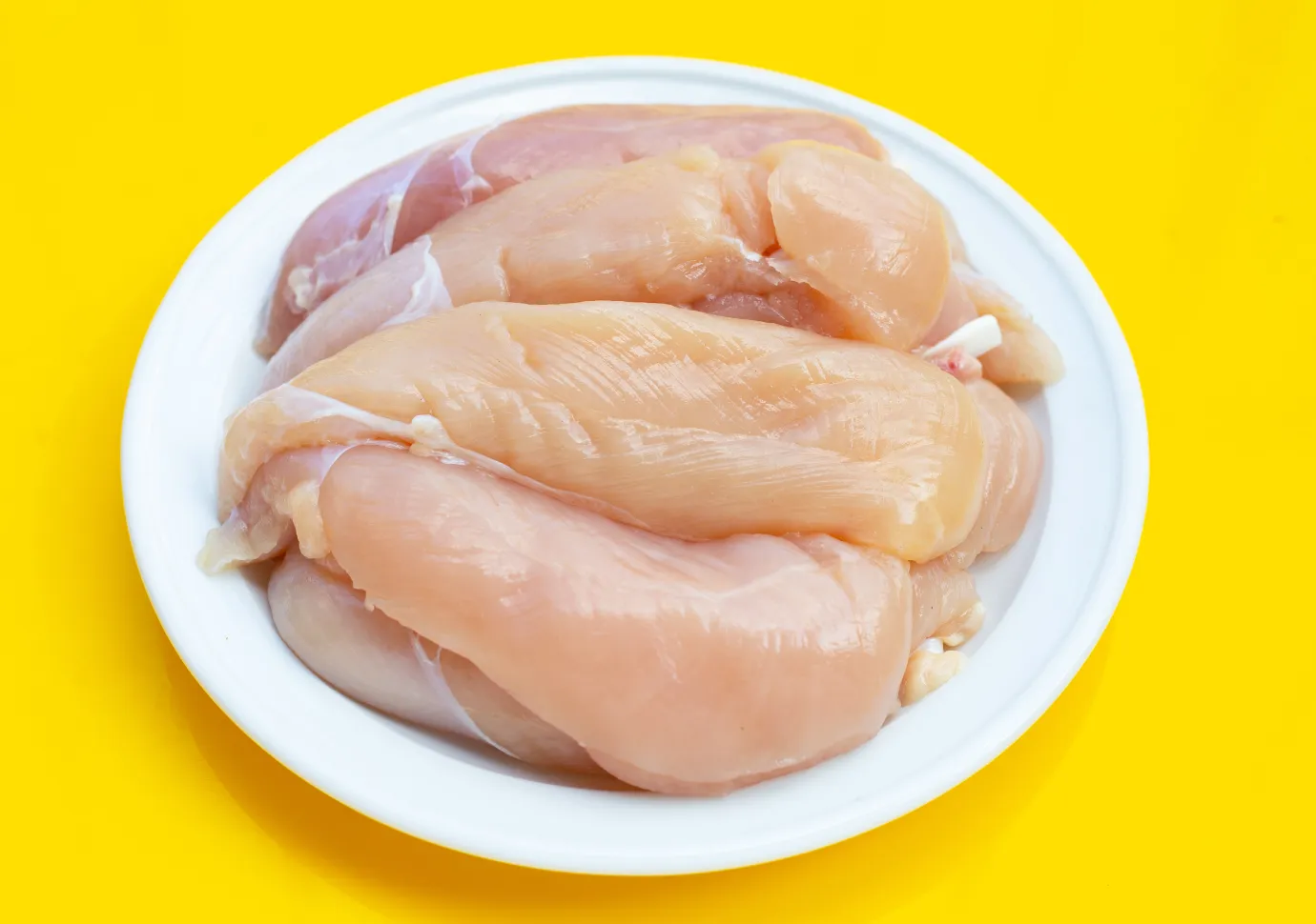 Preparing Buffalo Chicken Tenders in the kitchen.