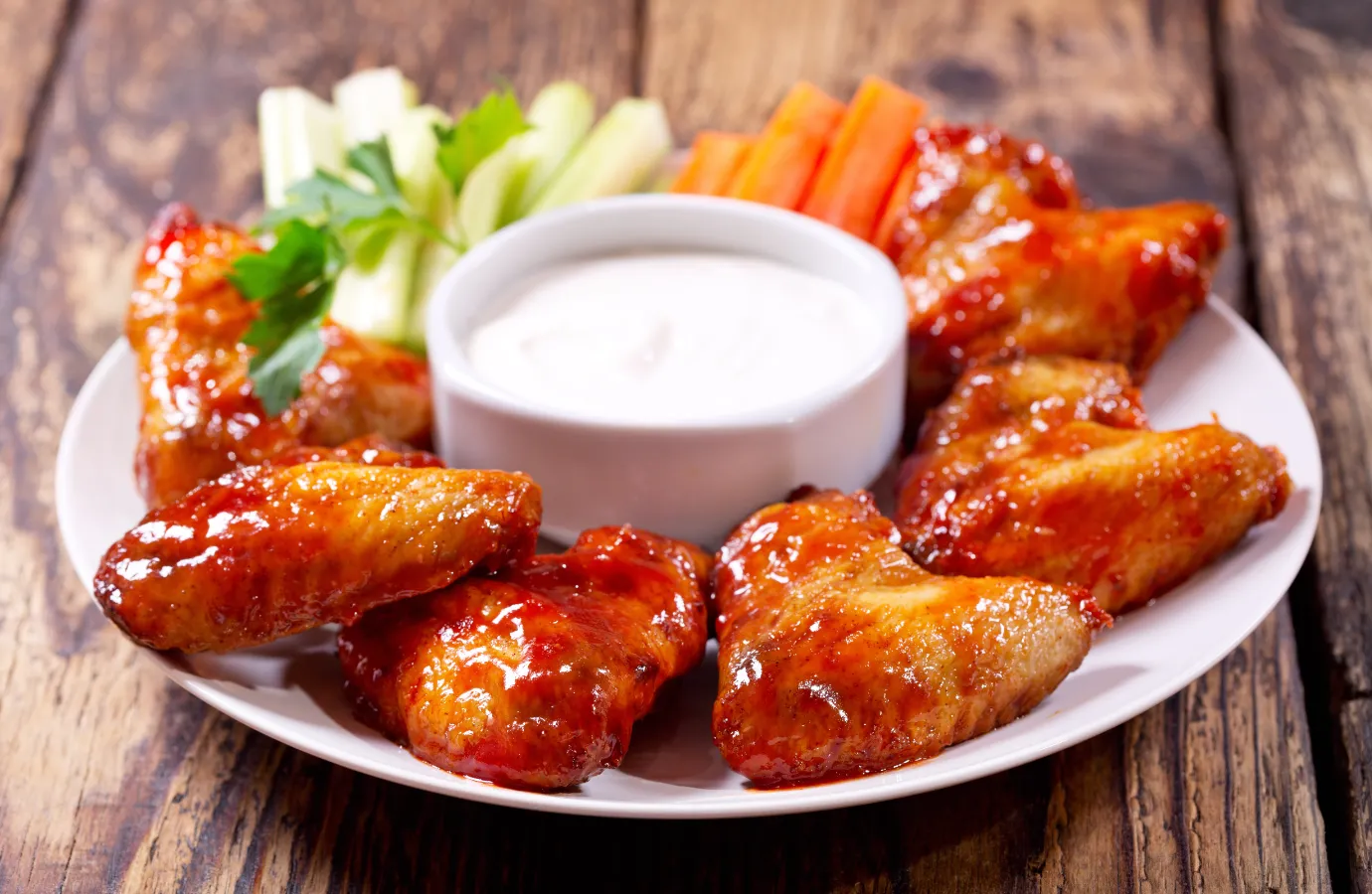 A platter showcasing the fiery Buffalo wings and Nashville hot chicken.