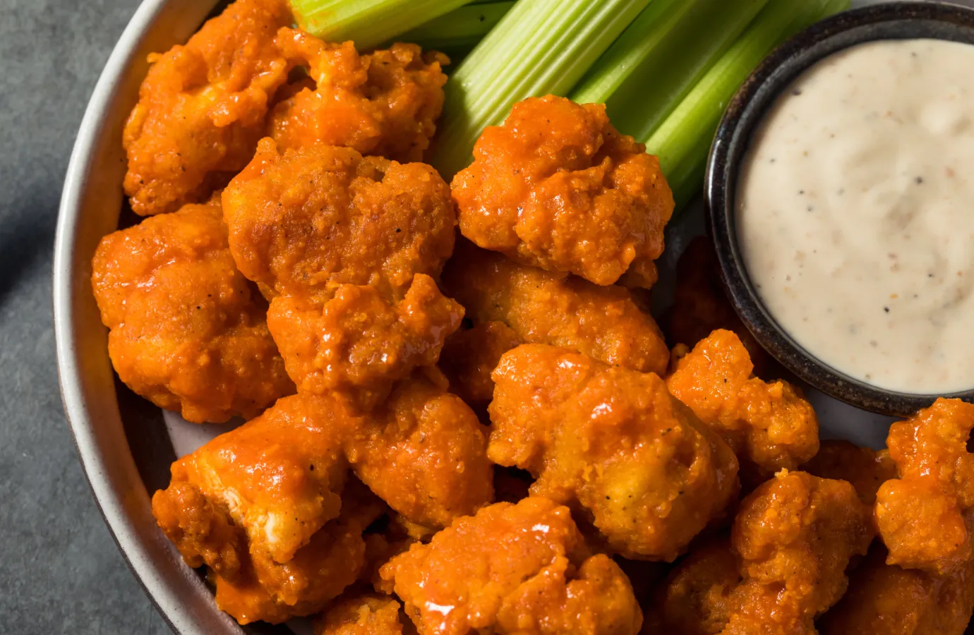 Buffalo chicken wings coated in tangy sauce.