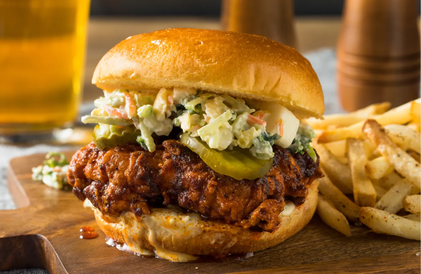 Nashville hot chicken served on white bread with pickles.