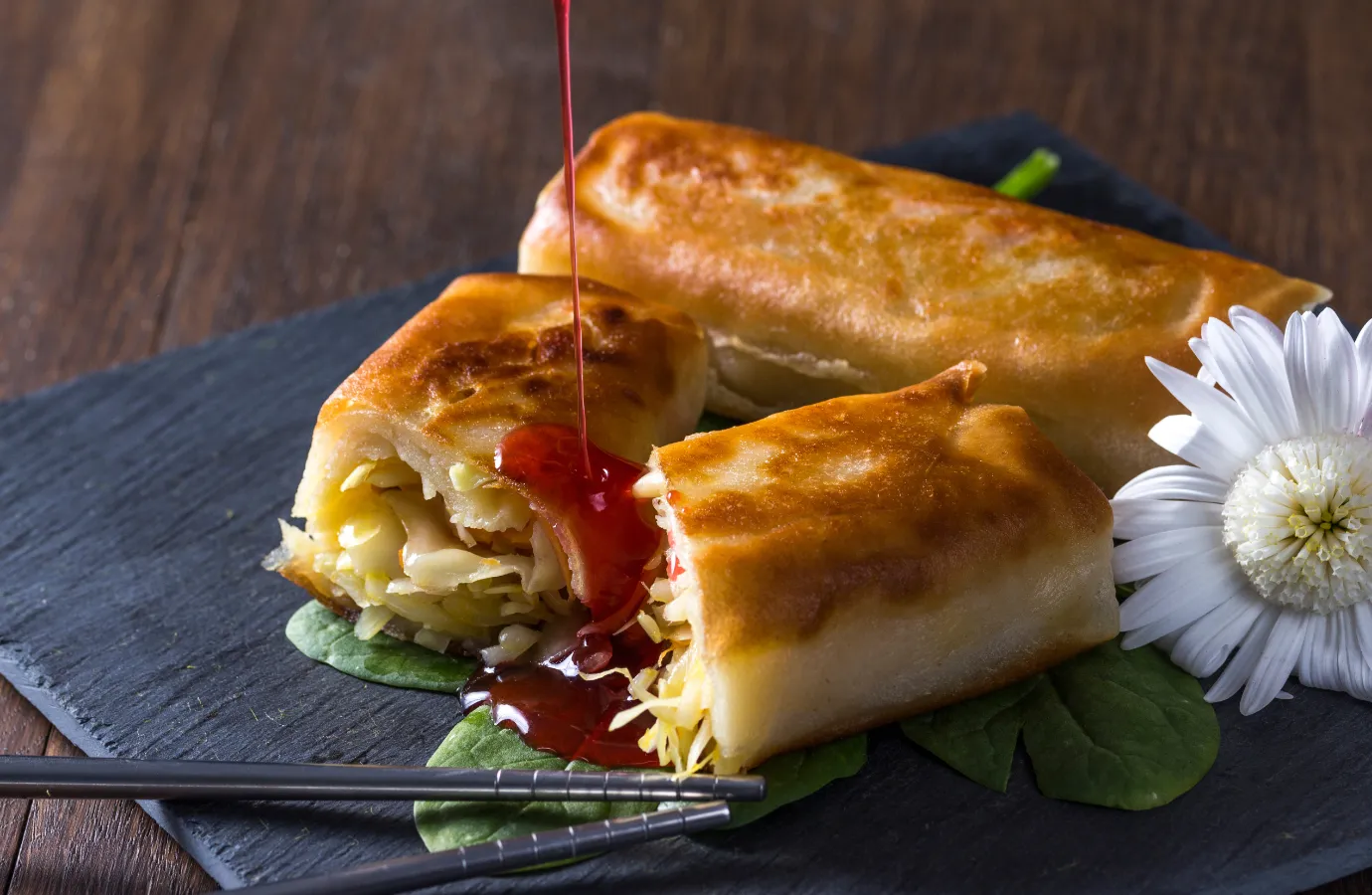 Crispy Chinese spring rolls served on a plate.