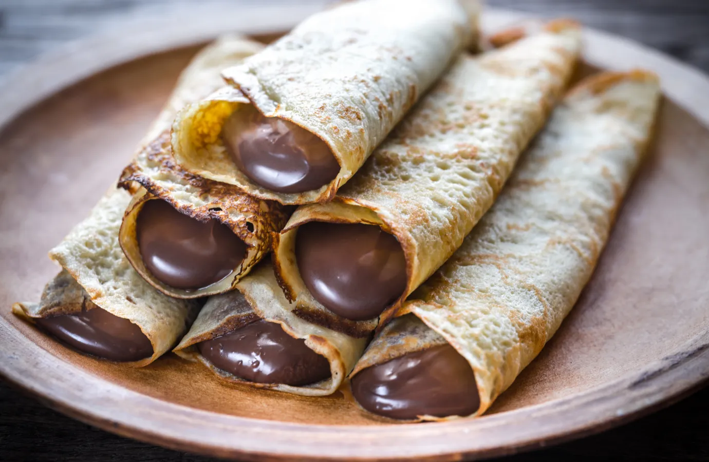 Freshly baked Nutella puff pastries on a cooling rack